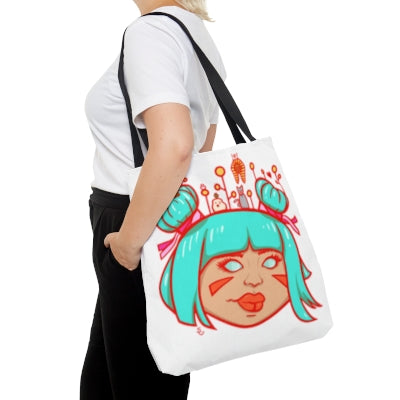 Person with a tote back over their shoulder. The tote bag shows a drawing of a girl with blue hair and sprouts and animals on top of her head.
